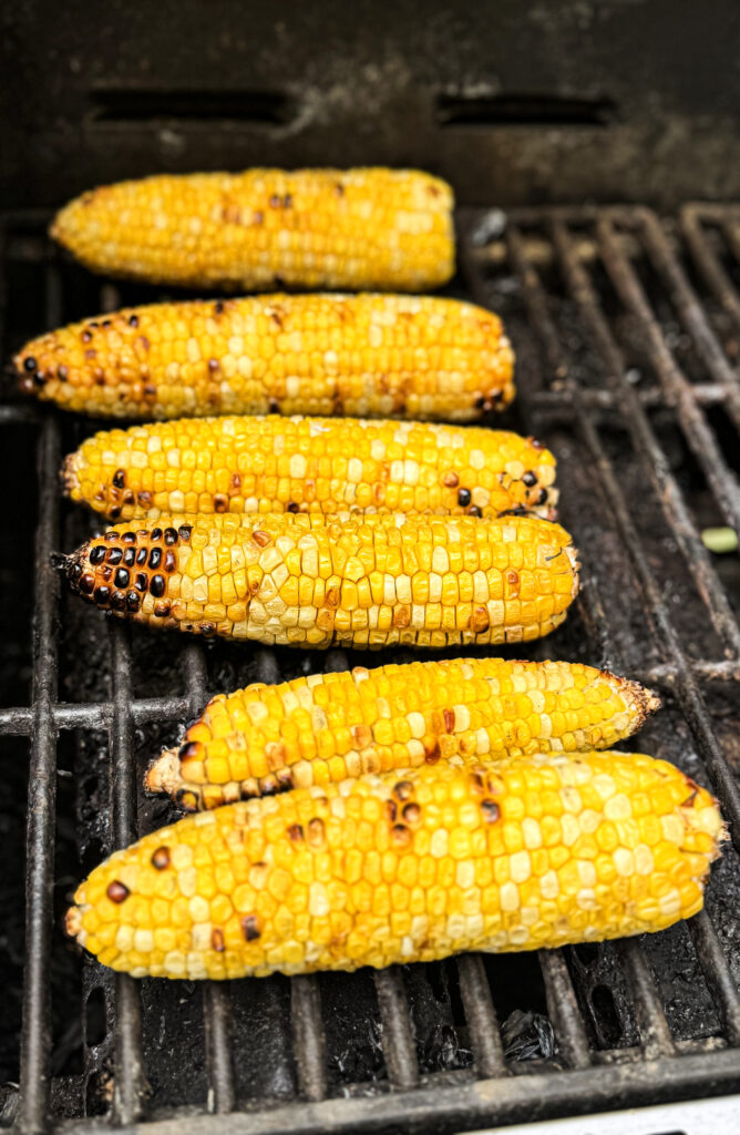 Ears of corn on a grill getting a nice char.