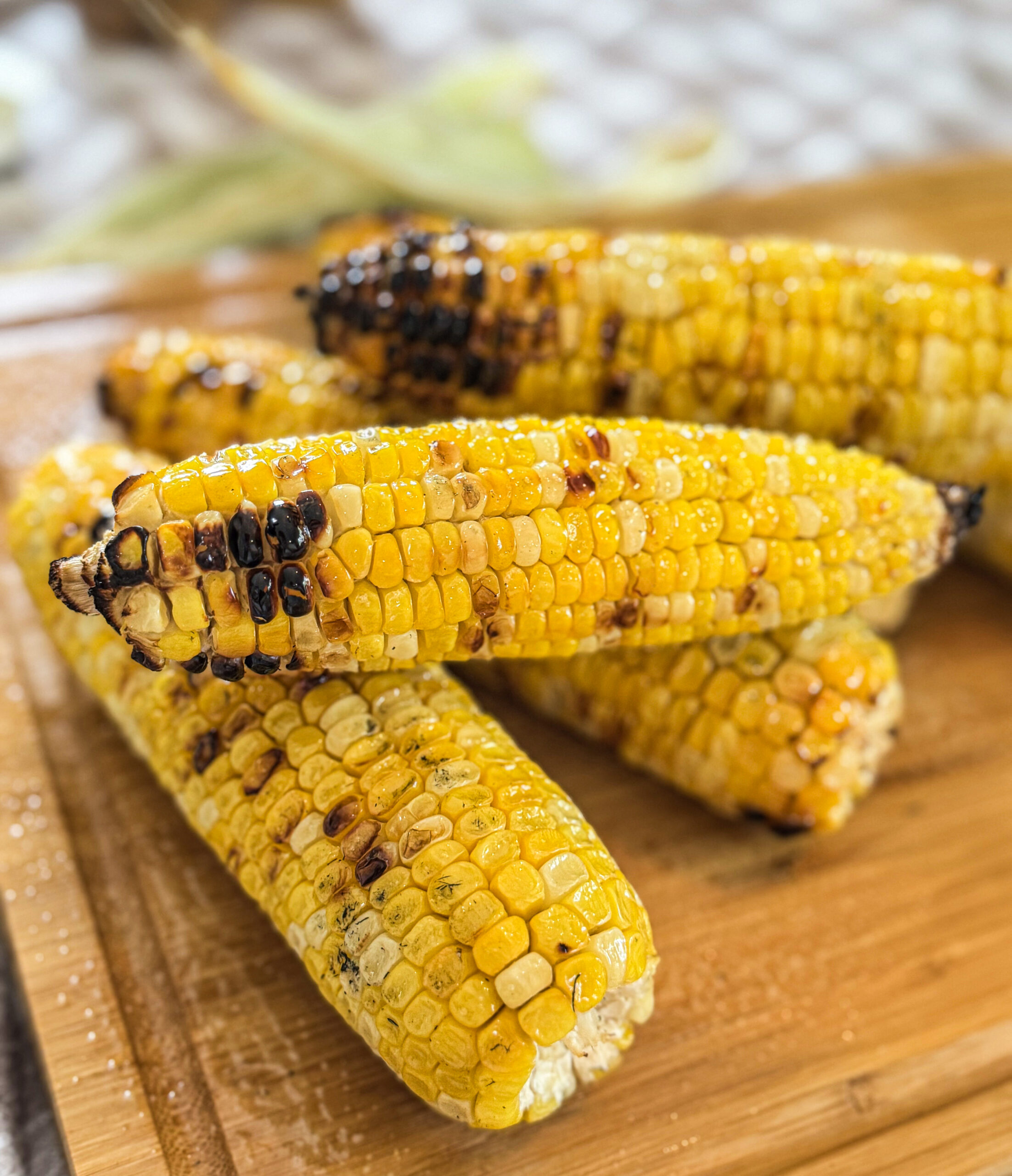 Close-up of grilled corn on the cob with a beautiful char.