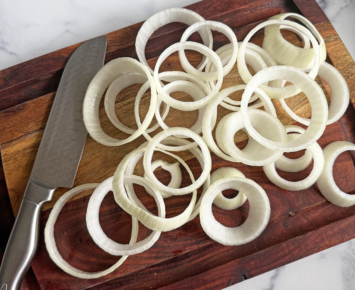 Raw onions to make beer battered onion rings.
