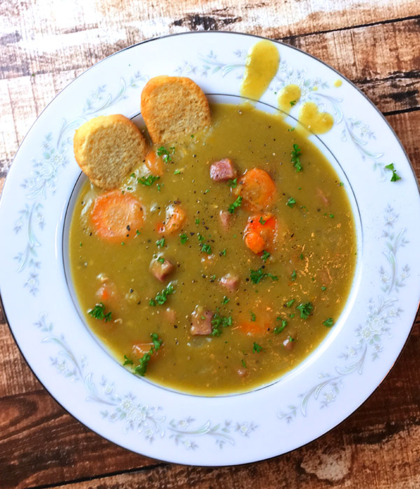 A bowl of split pea soup with ham made in an Instant Pot electric pressure cooker