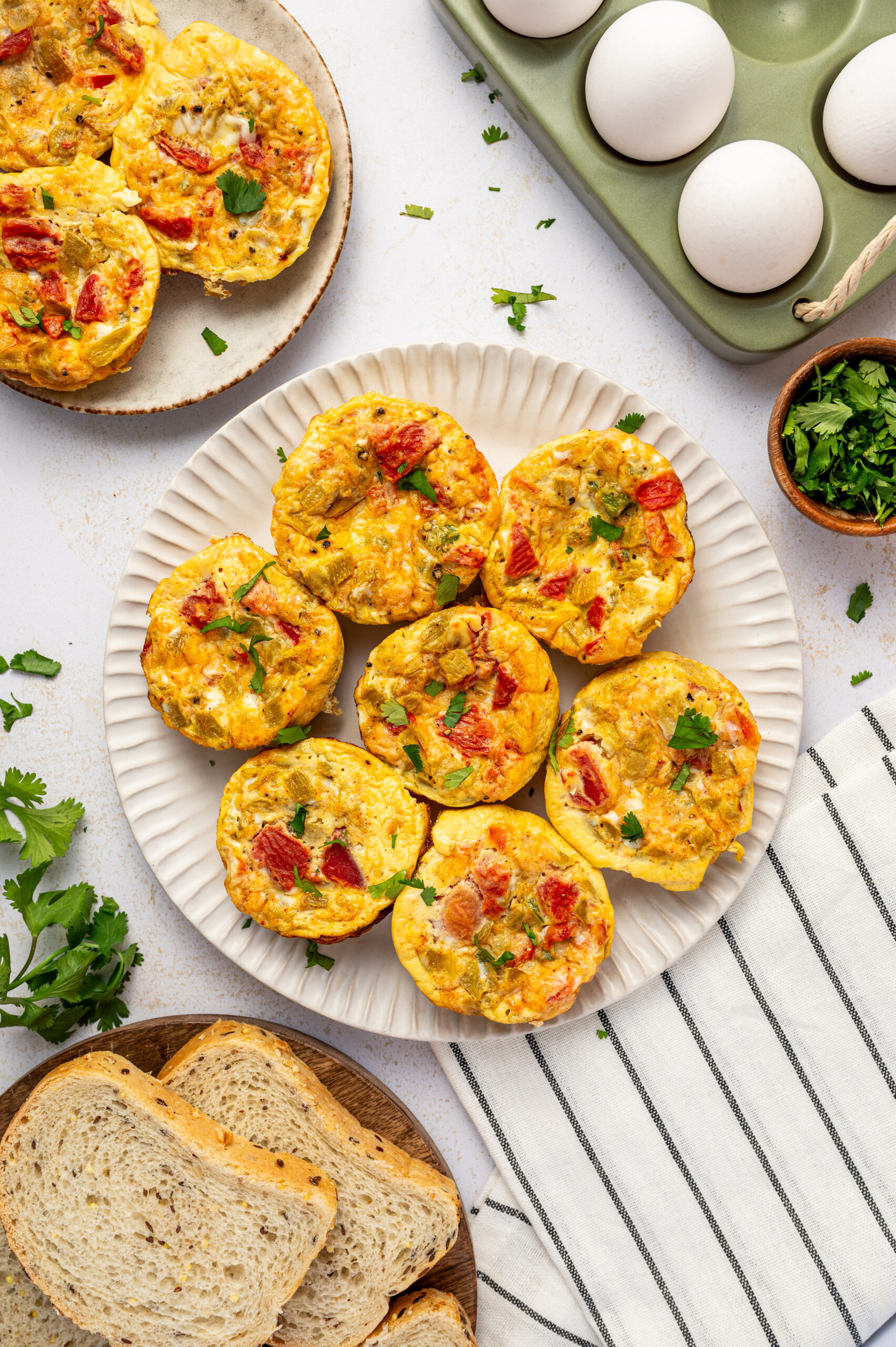 Hero shot of Southwest scrambled egg bites with tomatoes, peppers, and green chilies.