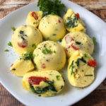 Instant Pot made egg bites. Filled with gouda cheese, fresh spinach and roasted red peppers.