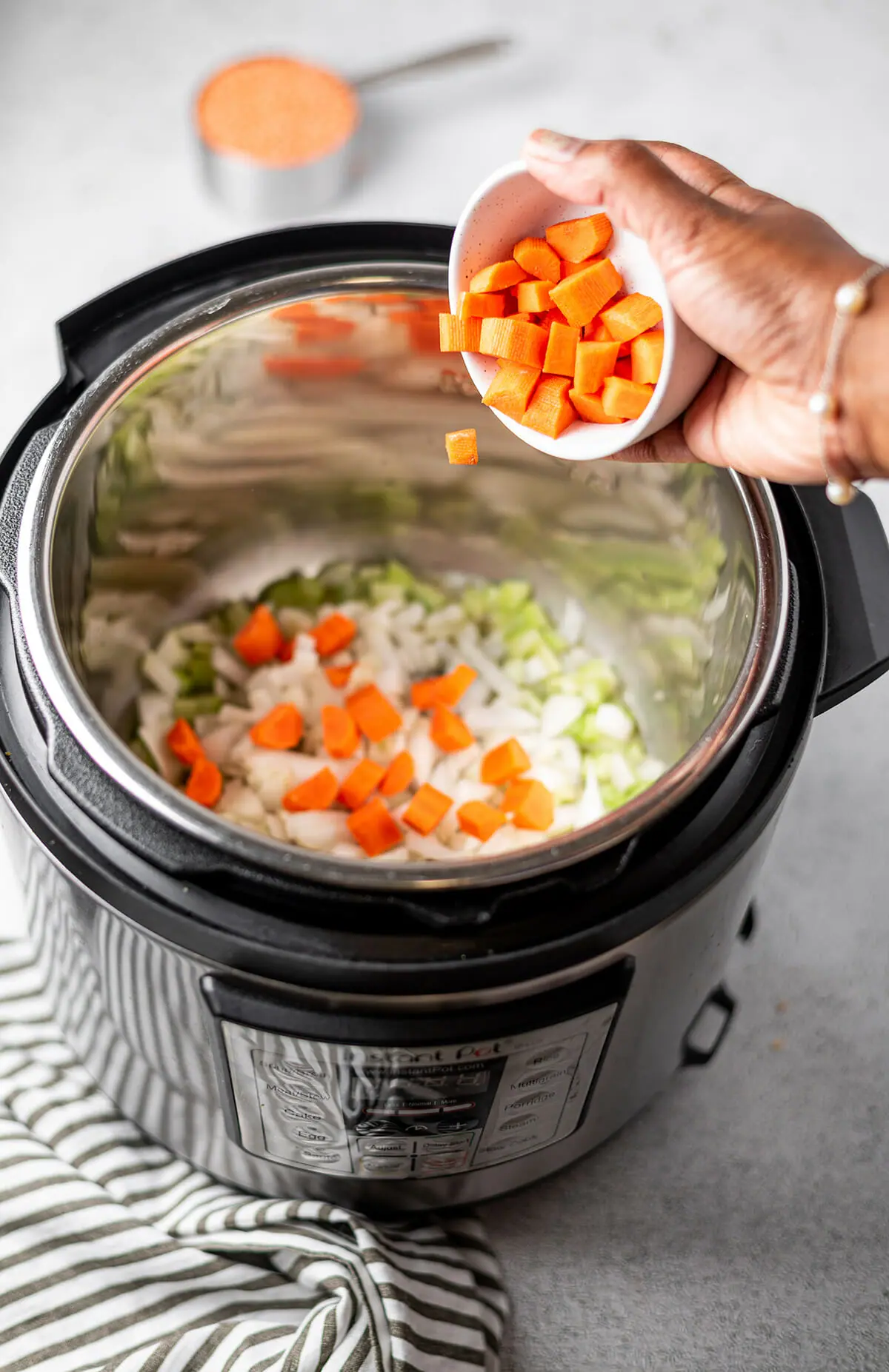 Making red lentil soup in an Instant Pot pressure cooker.