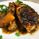 dish of Instant Pot chicken thighs and potatoes with Greek seasonings