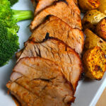 Best Damn Air Fryer Pork Tenderloin served with broccoli and potatoes