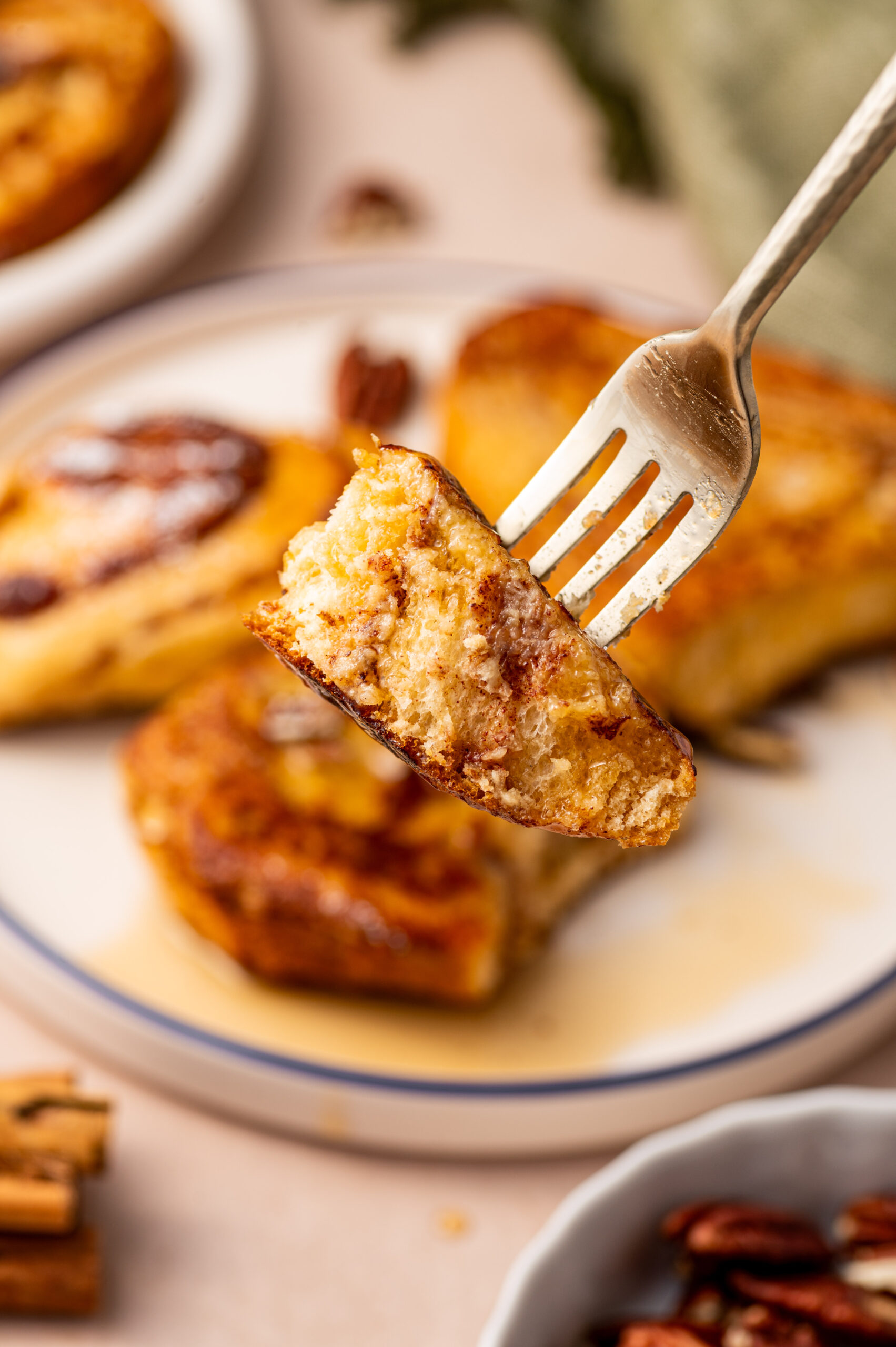 A forkful of cinnamon roll French toast.