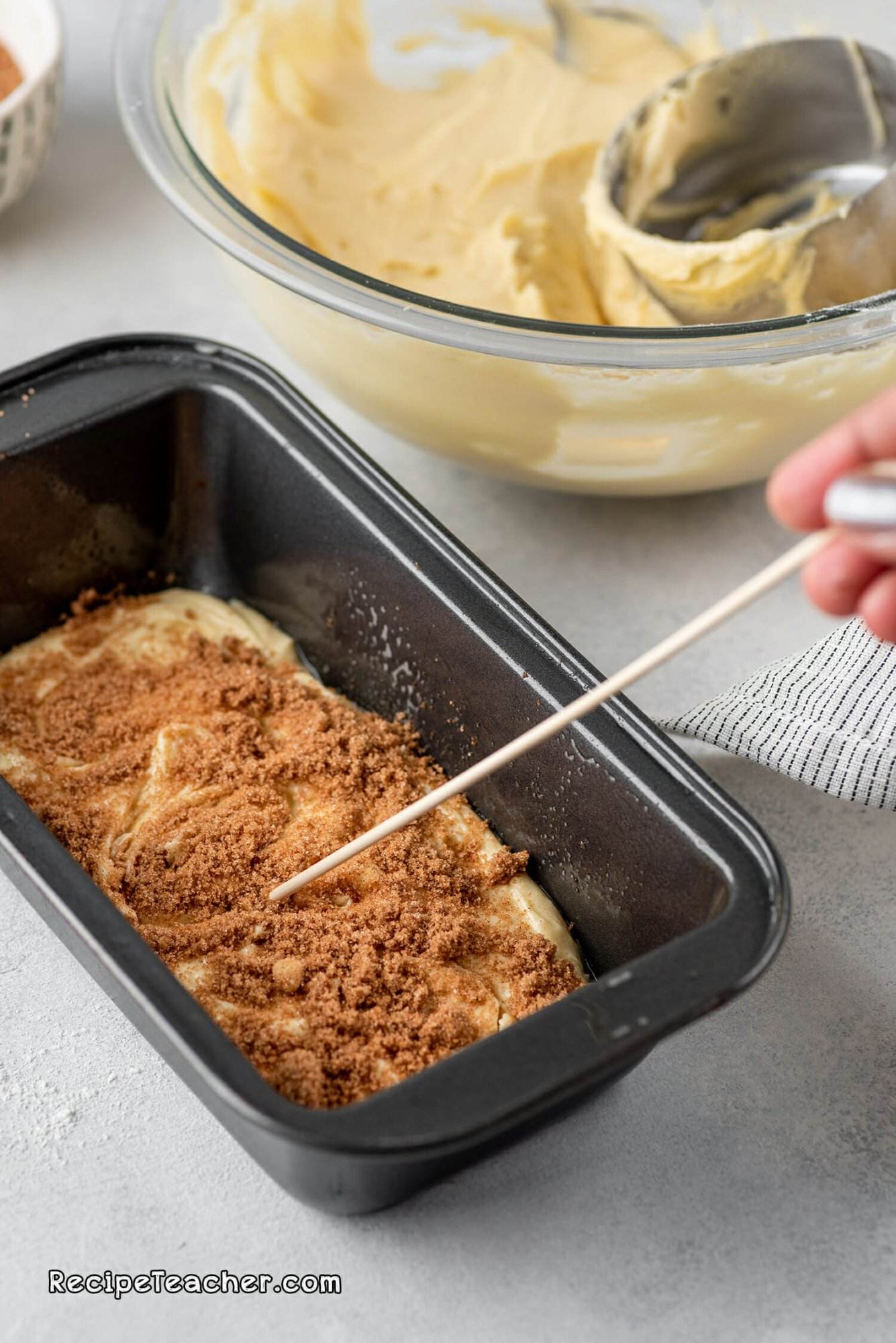 Adding the cinnamon for our cinnamon swirl loaf recipe