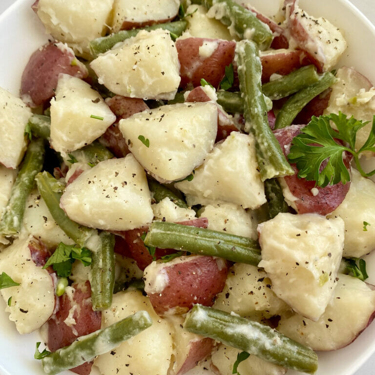 Recipe for Instant Pot Potatoes and Green Beans with creamy garlic parmesan sauce.