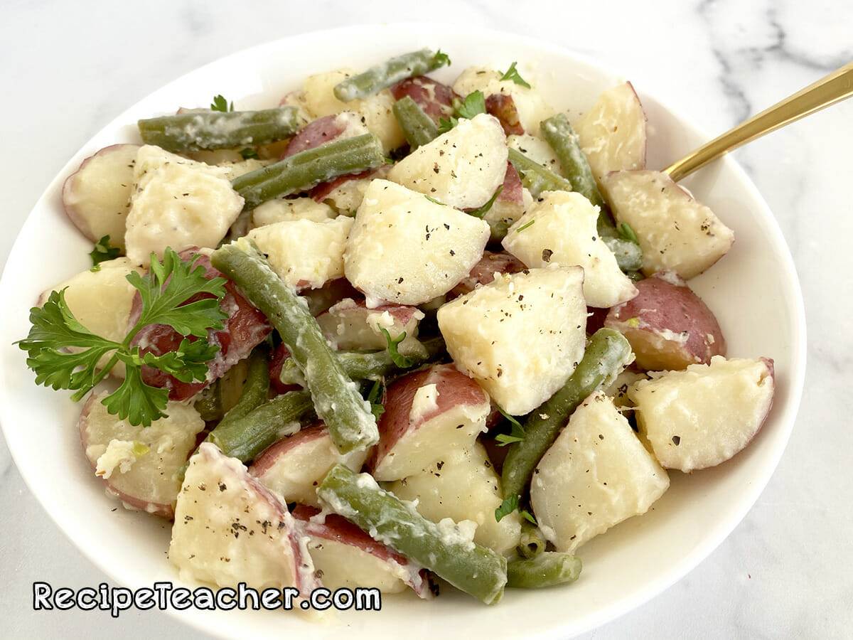 Instant Pot Red Potatoes with Green beans in a creamy Parmesan garlic sauce.