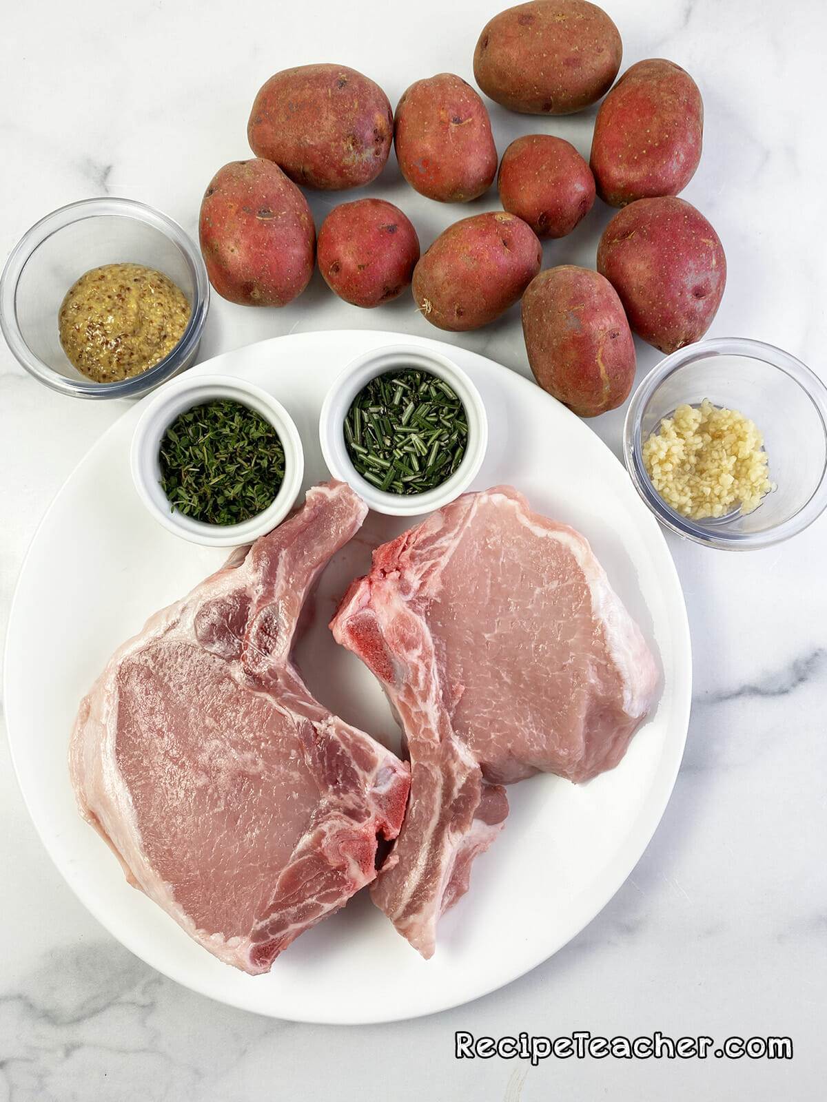 Sheet pan pork chops and potatoes