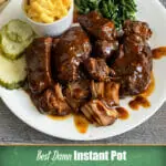 Instant Pot country style ribs served with sautéed spinach and homemade mac and cheese.