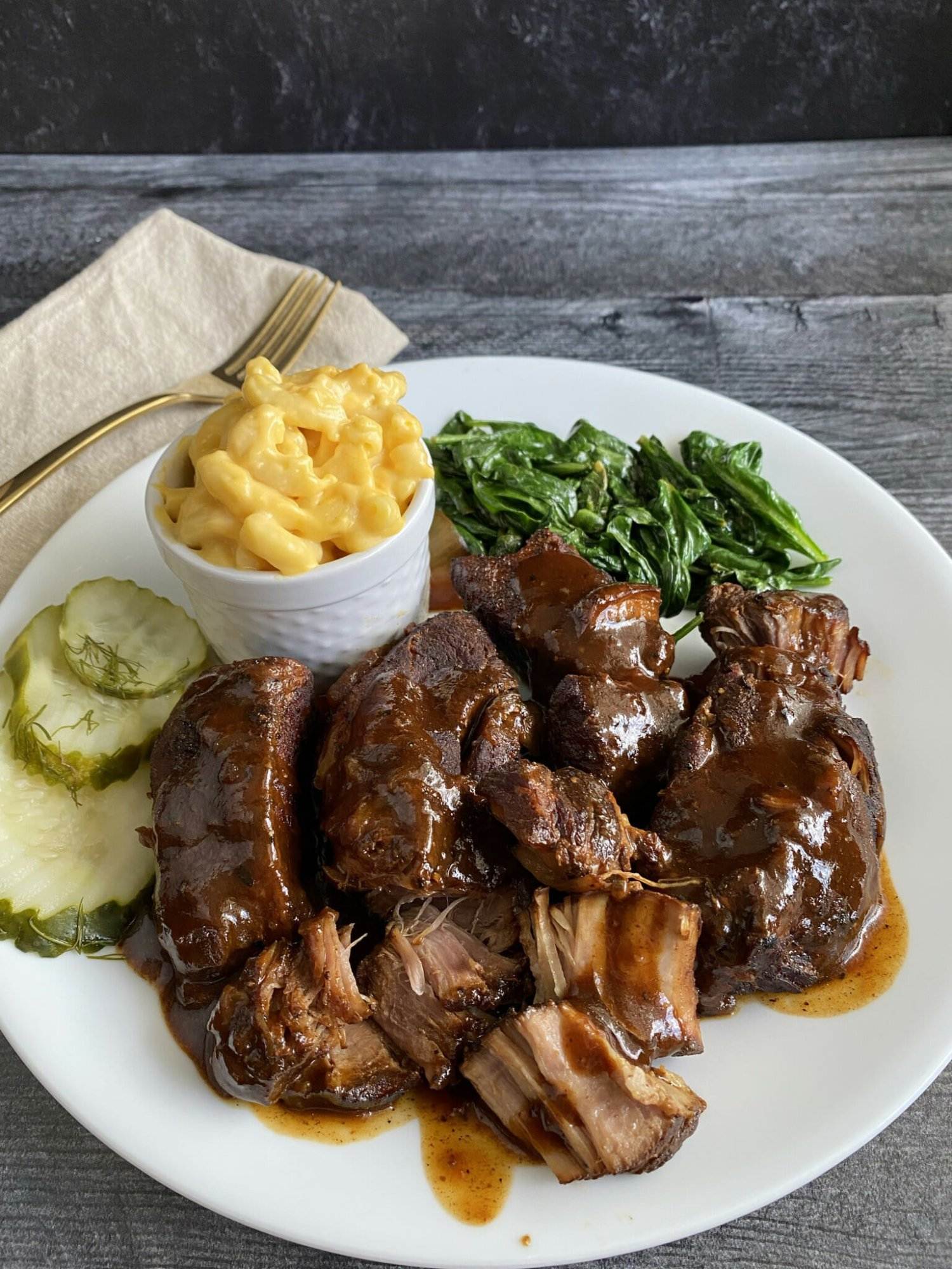 Instant Pot country-style ribs on a plate with a side of mac and cheese.