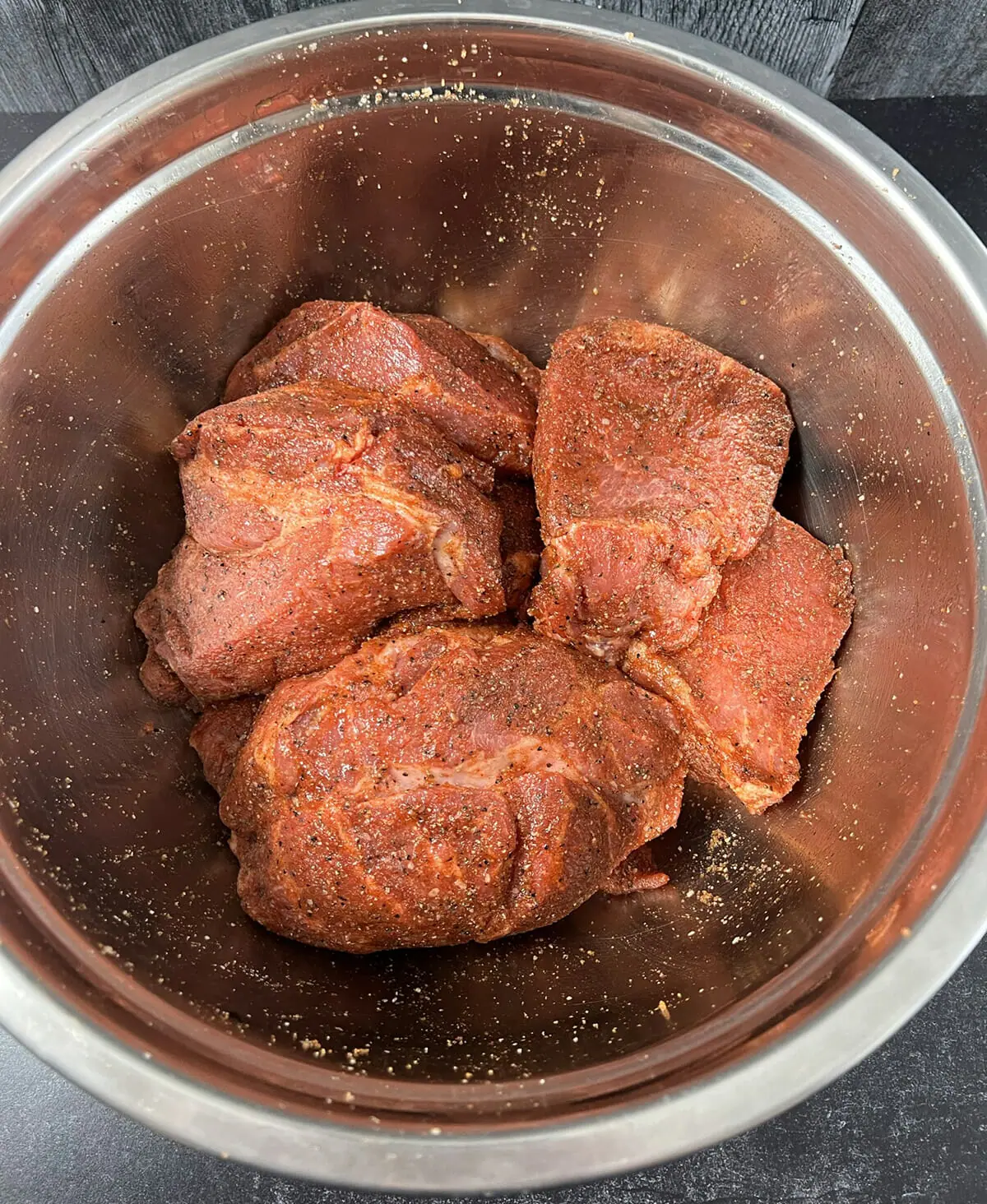 Seasoning pork for pulled pork recipe.
