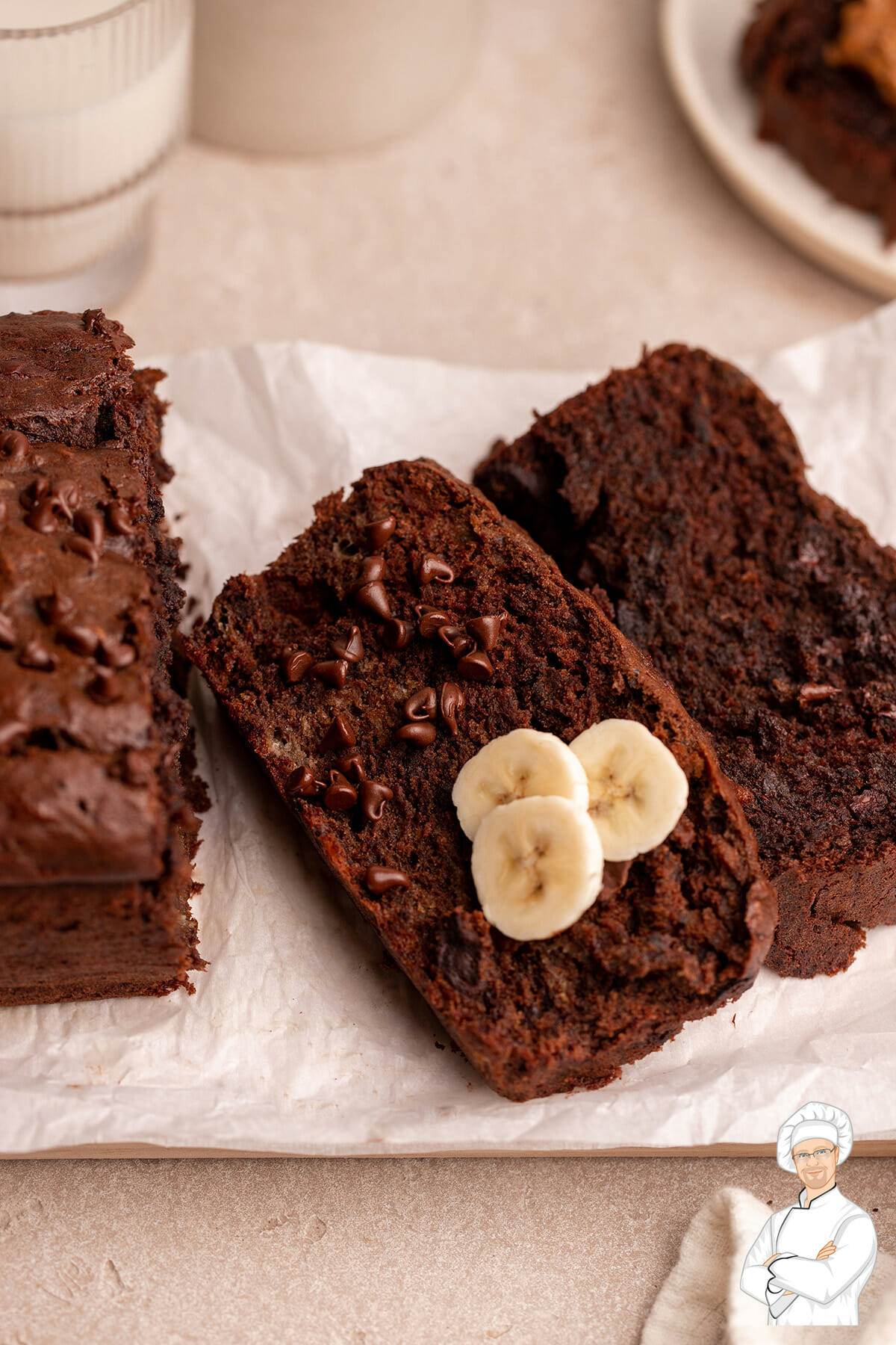 Sliced chocolate banana bread with sliced bananas