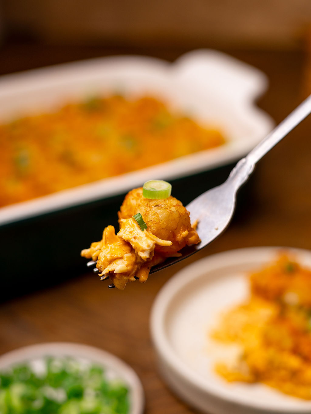 A forkful of tater tot casserole.