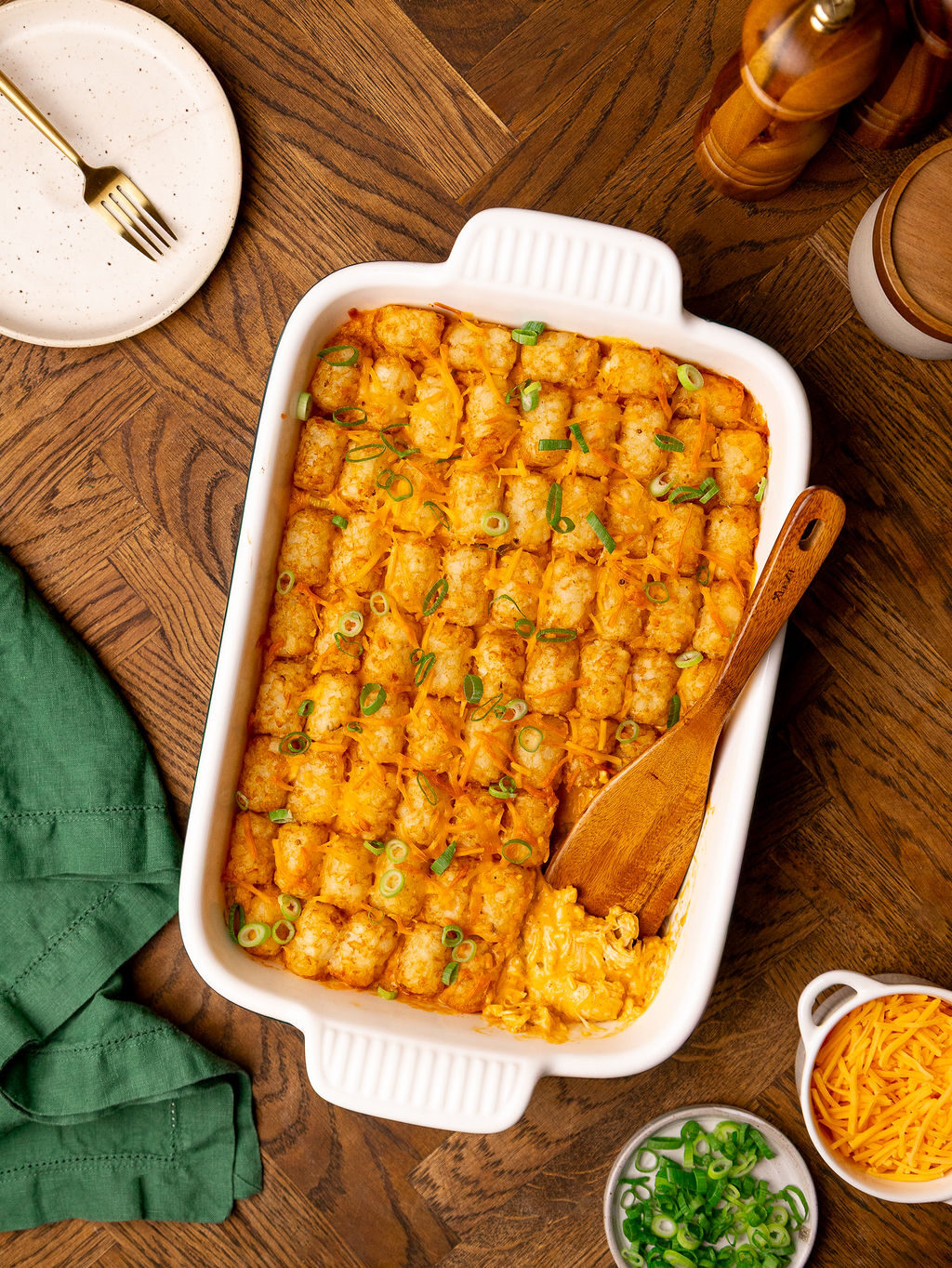 Buffalo chicken tater tot casserole in a baking dish ready to serve.