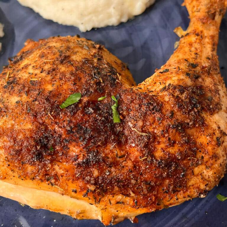 Perfectly cooked, oven baked chicken quarters served with coleslaw and mashed potatoes.
