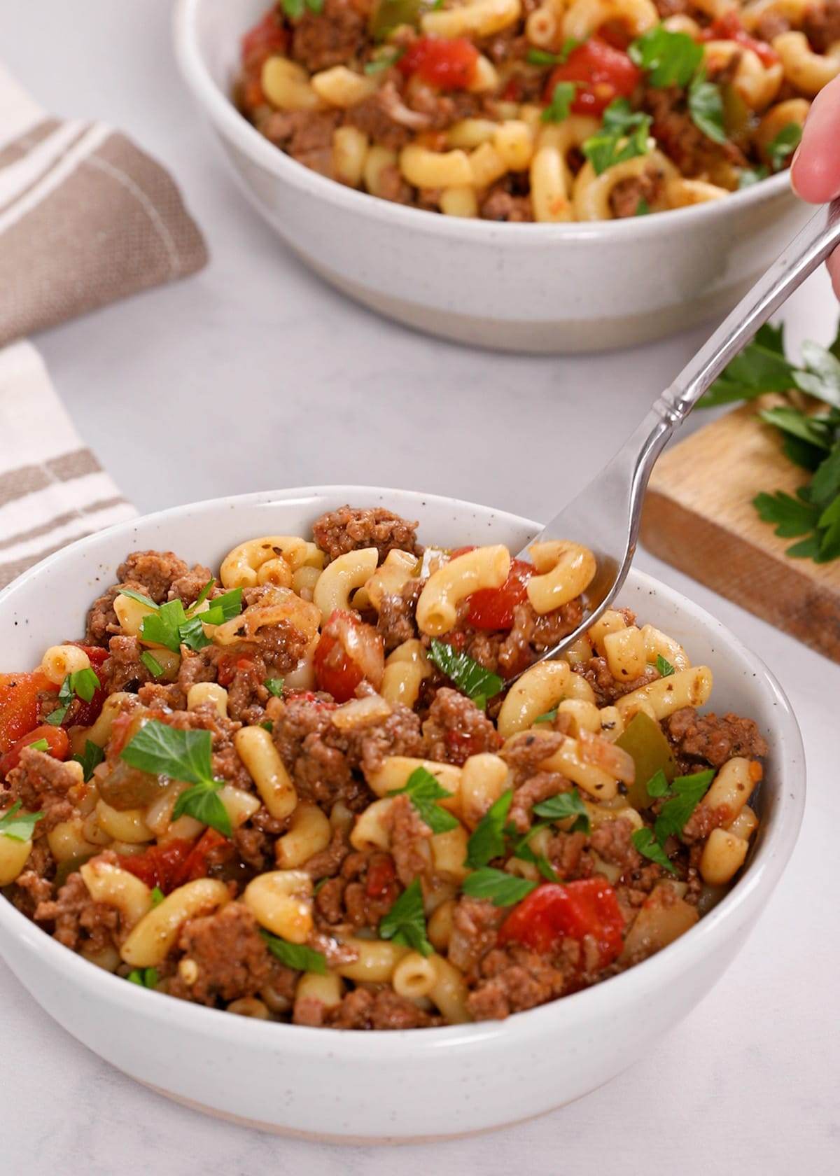 American goulash in a white bowl.