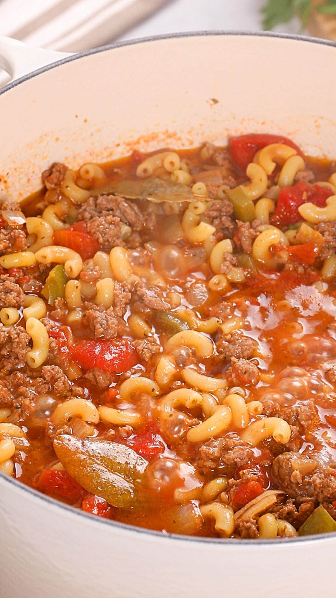 American goulash cooking in a pot.