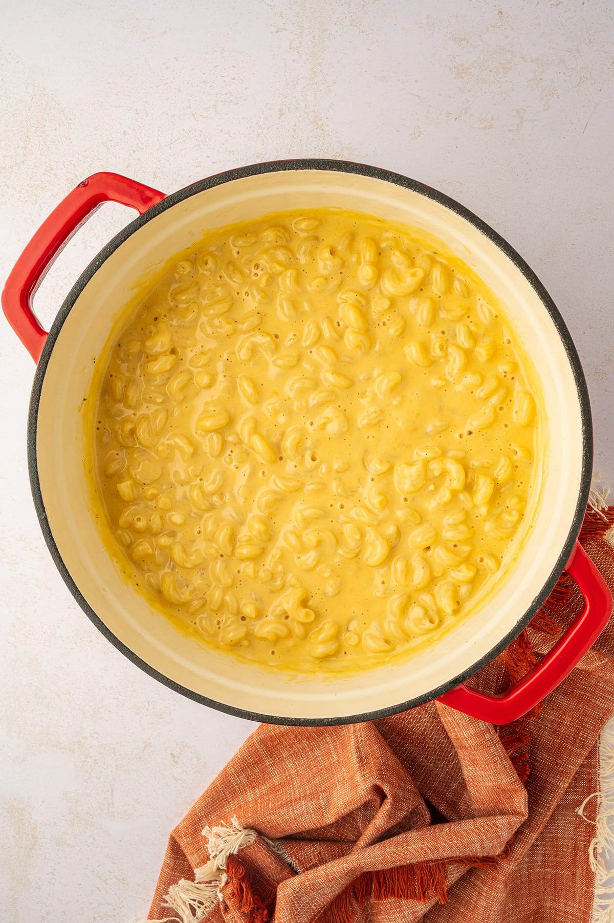 Homemade mac and cheese ready to be baked in the oven.