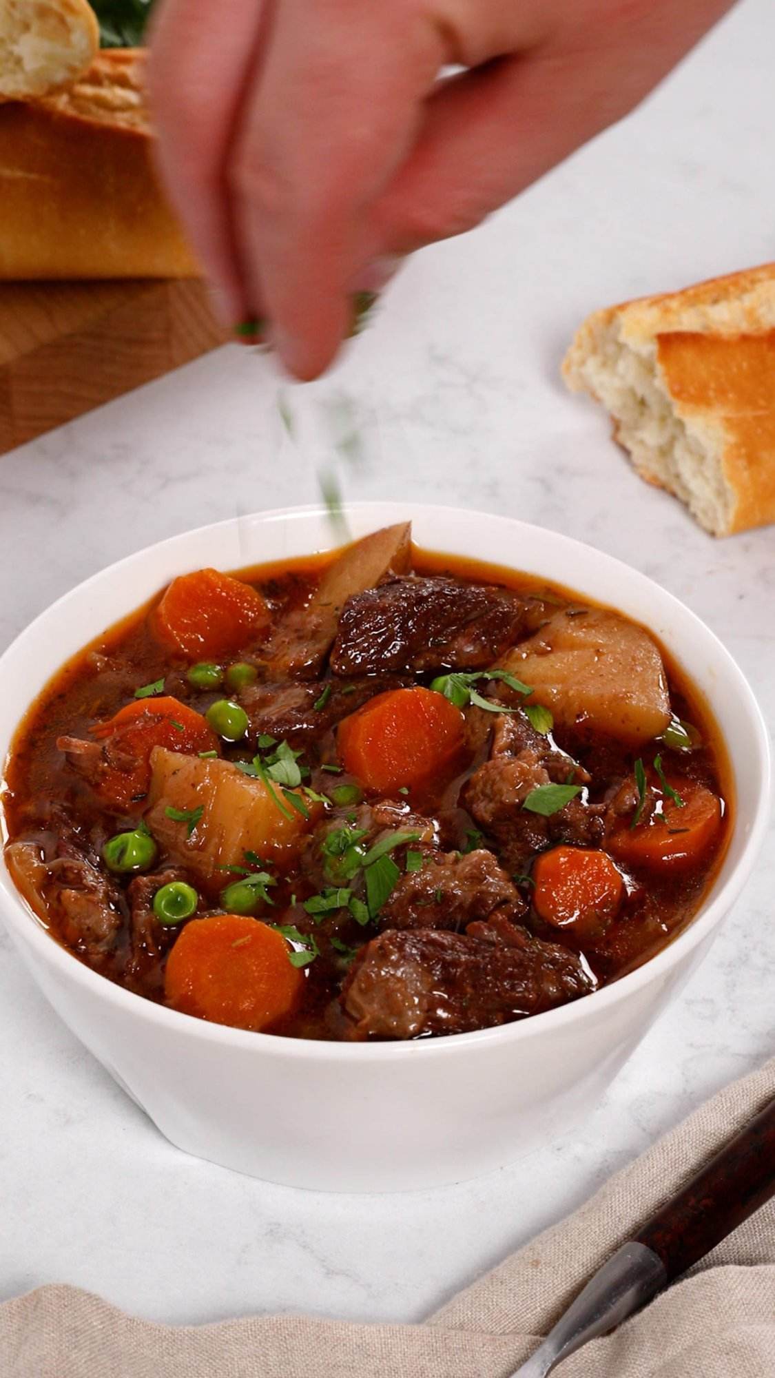 Serving a bowl of homemade Instant Pot beef stew.