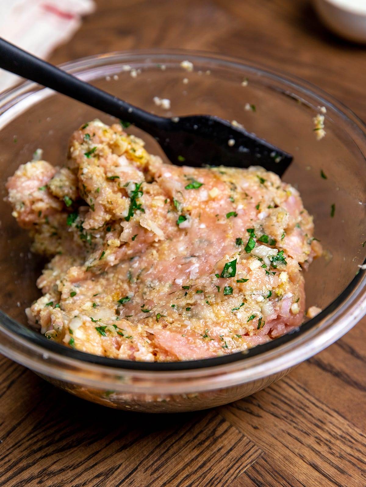 Preparing the ingredients to make air fryer Greek chicken meatballs.