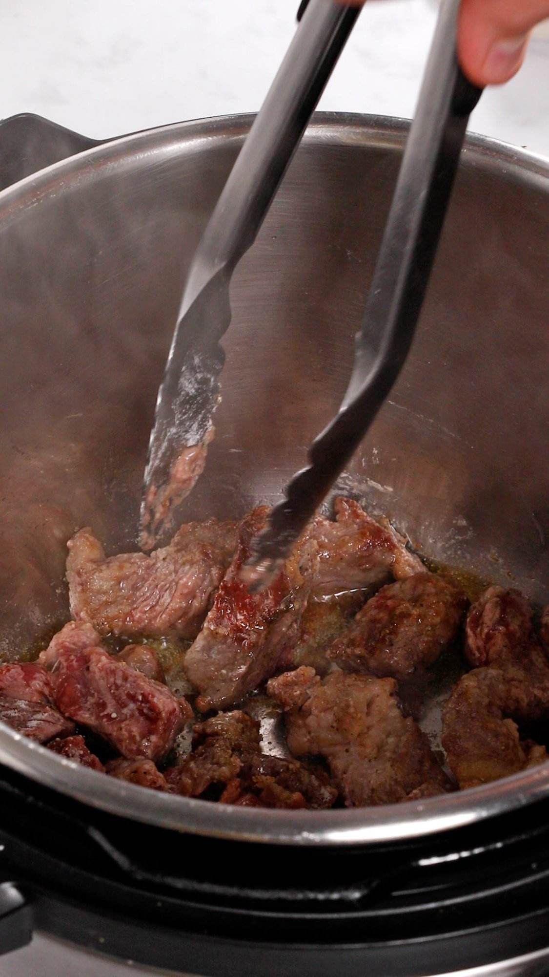 Browning beef for Instant Pot beef stew recipe.
