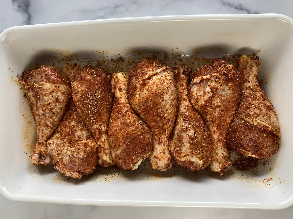 seasoned chicken legs ready for the grill.