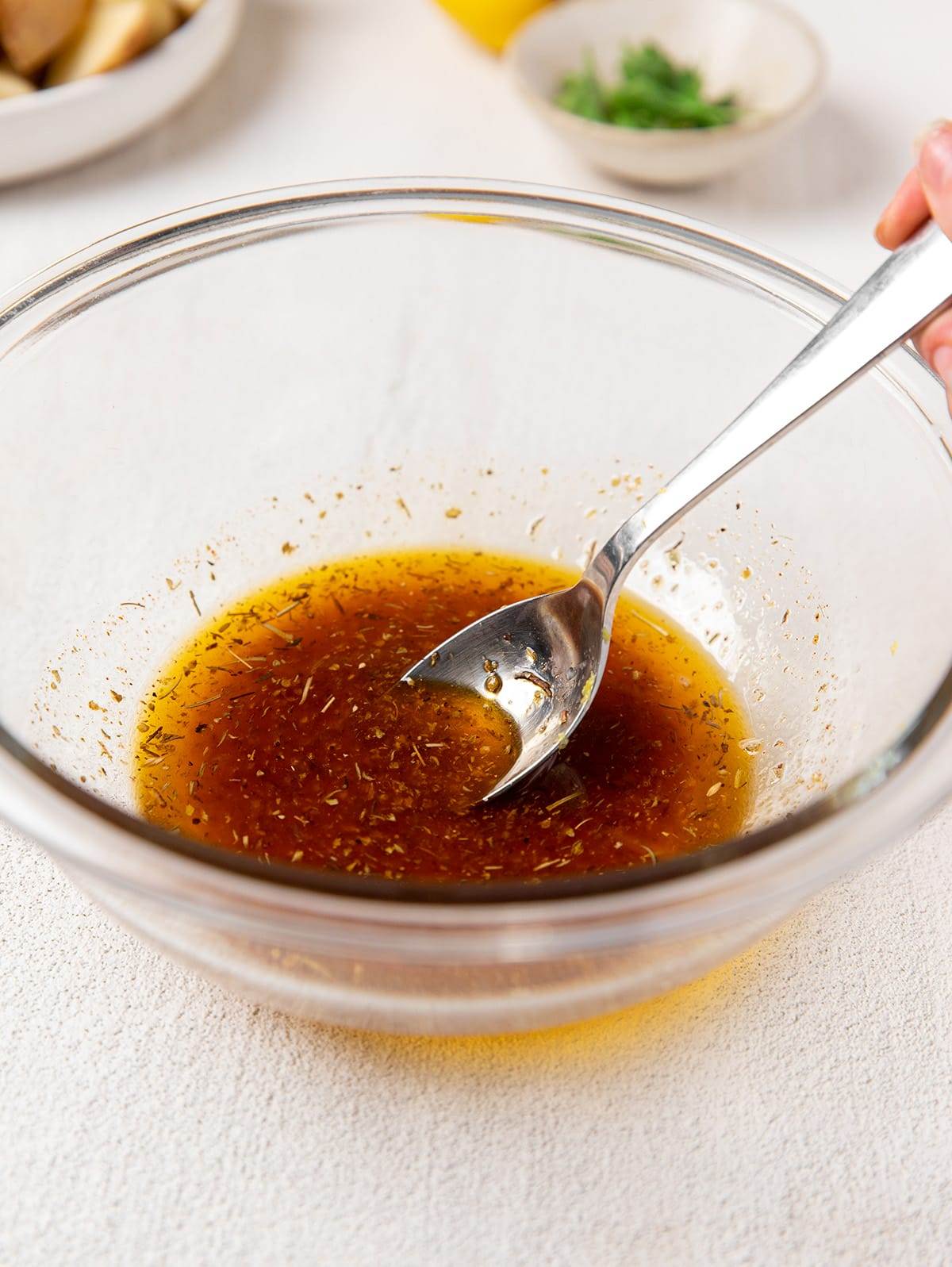 Making the marinade for sheet pan lemon chicken and potatoes recipe.