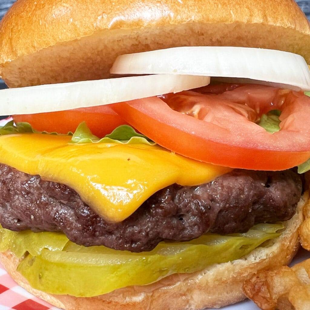 A cheeseburger made in an air fryer.