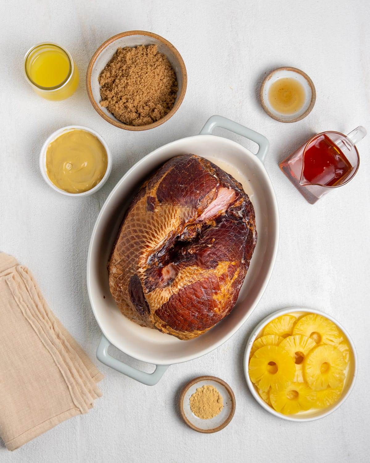 All the ingredients needed to make a maple and brown sugar glazed ham.