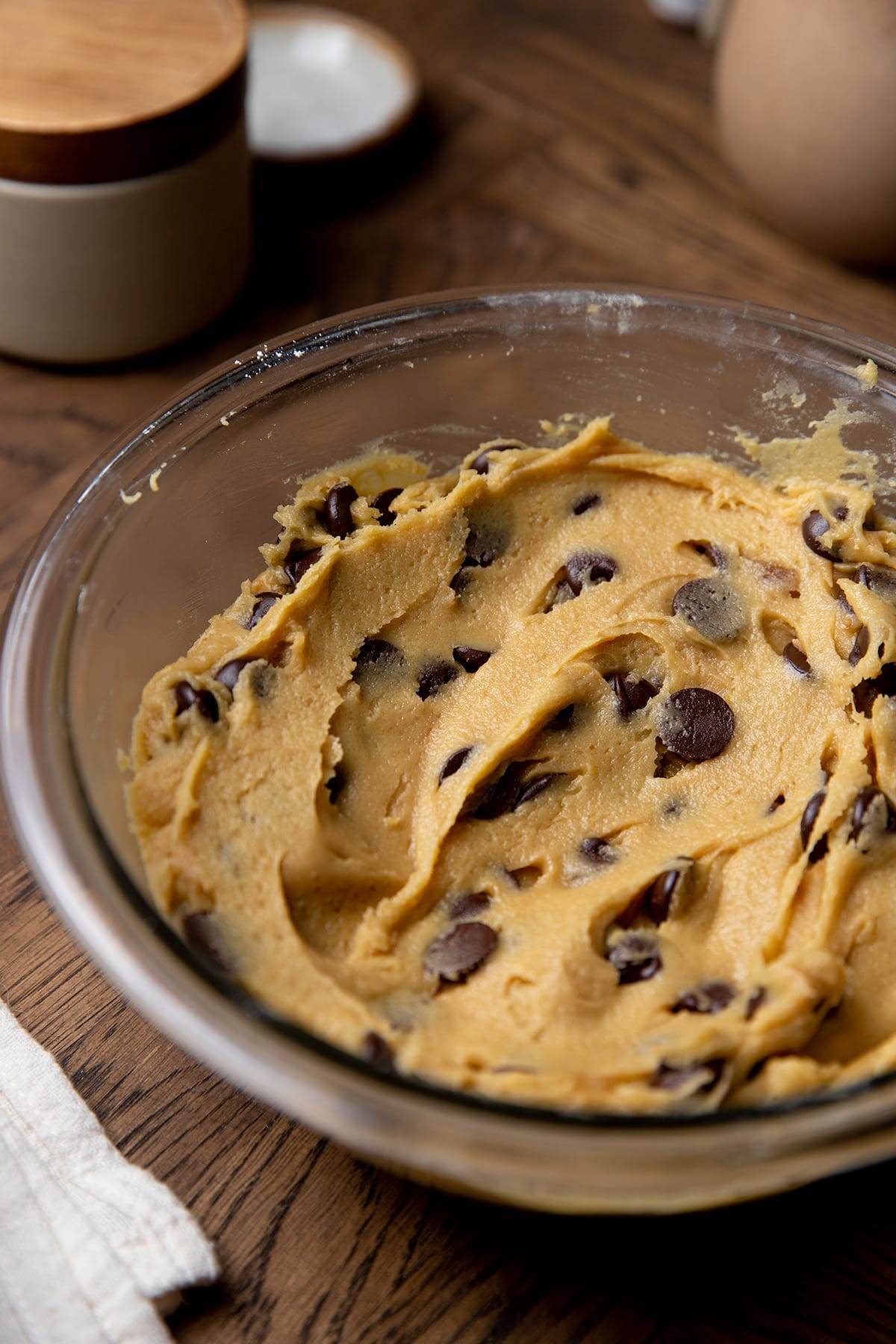 Mixing the ingredients in a bowl to make a giant chocolate skillet cookie.