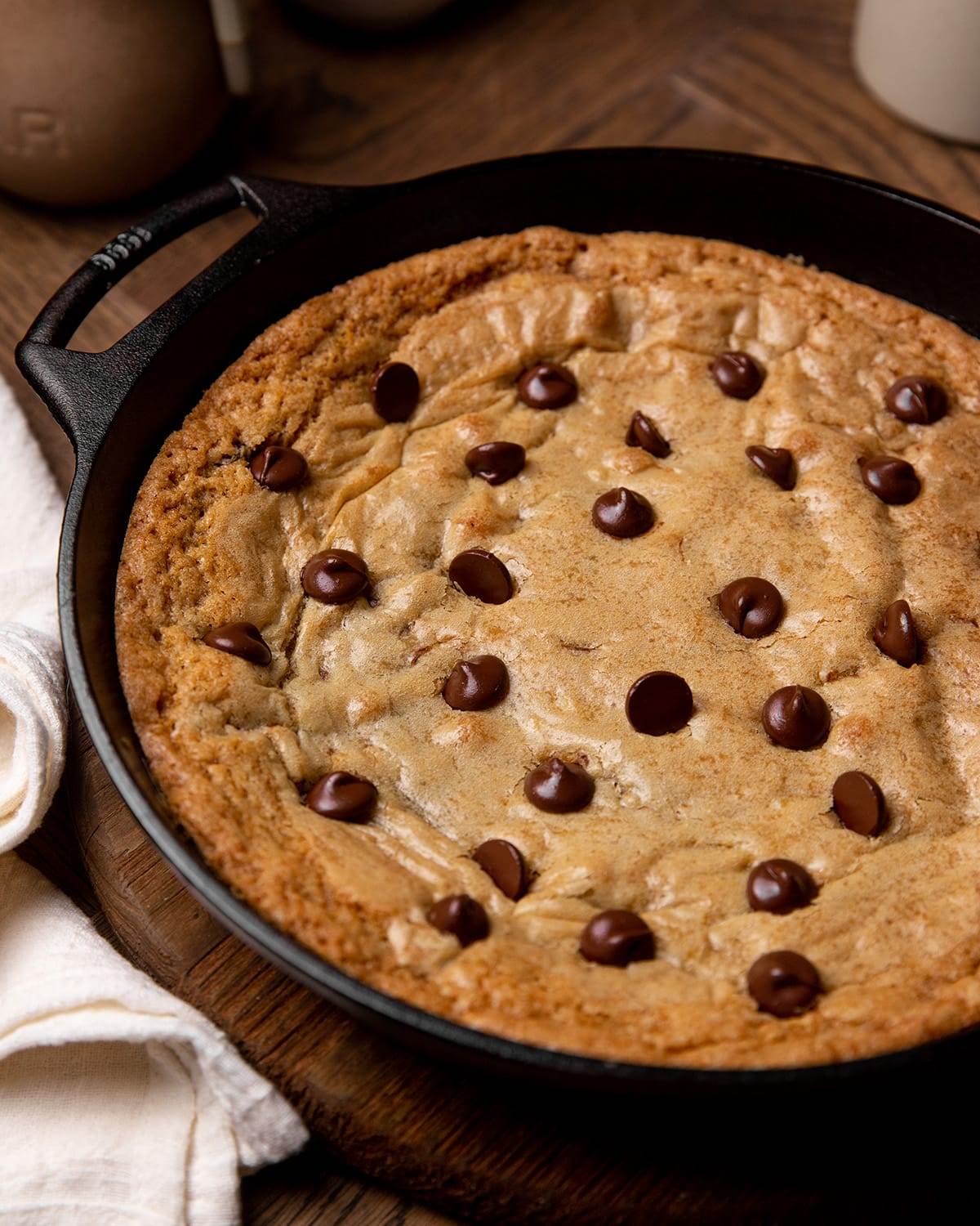 A giant skillet chocolate chip cookie fresh out of the oven.