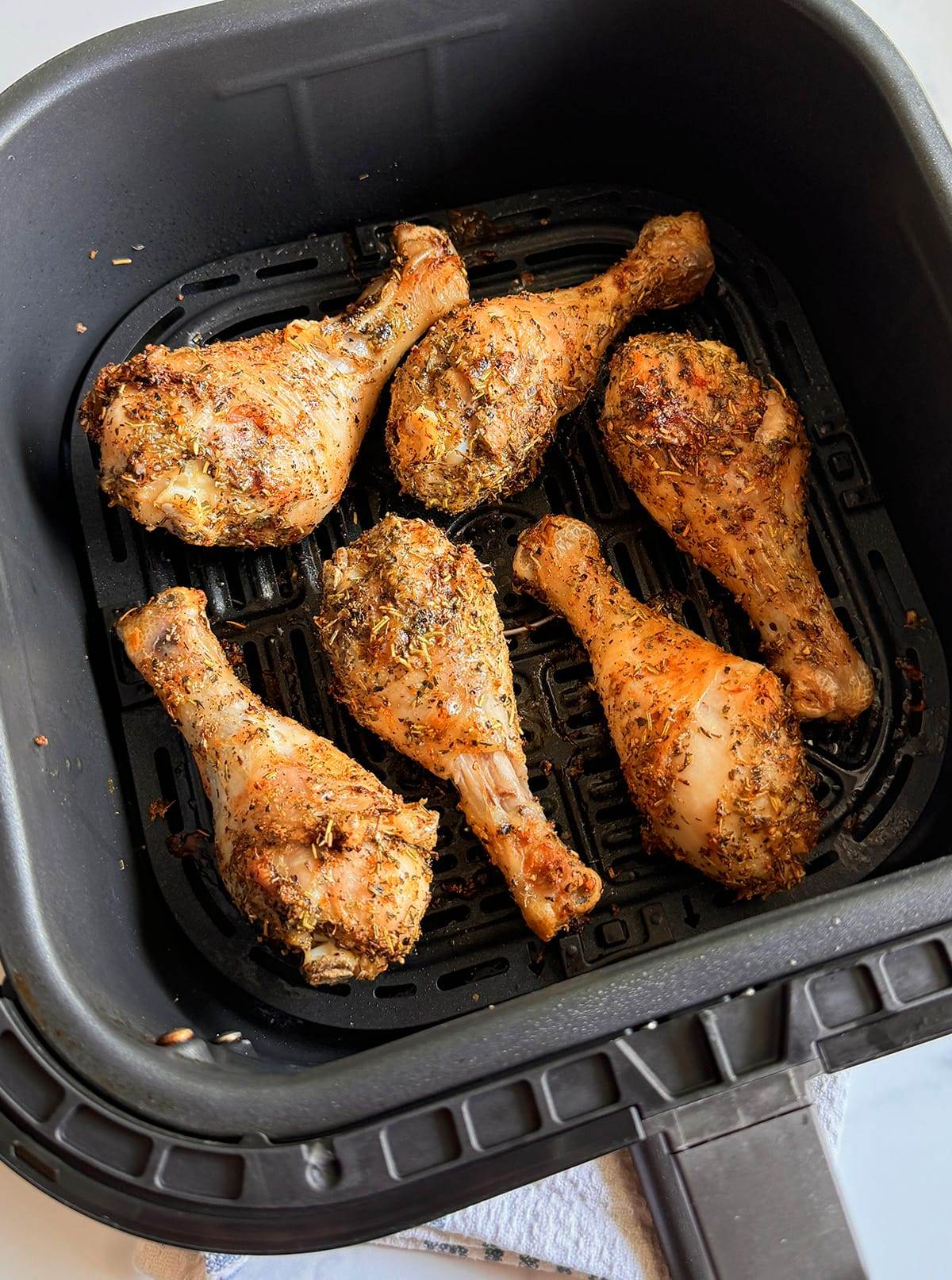 Greek chicken legs cooked in an air fryer. 