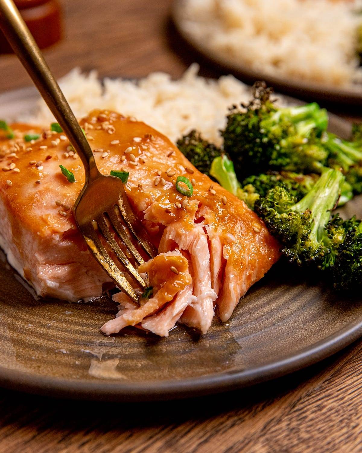 Using s fork to enjoy tender, flaky miso salmon and broccoli.