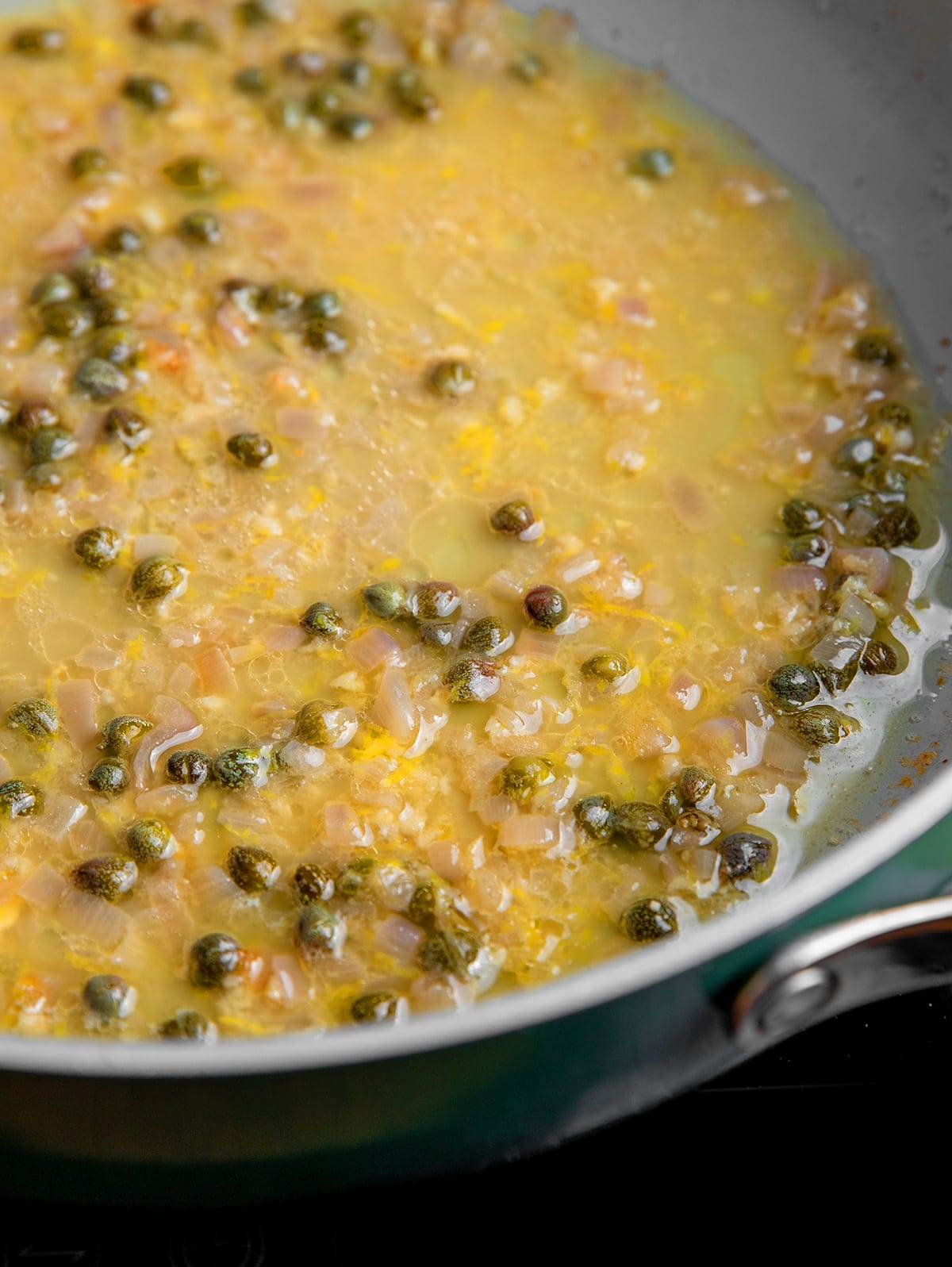 Making the lemon butter sauce for chicken piccata.