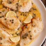 Homemade chicken piccata served on a plate.