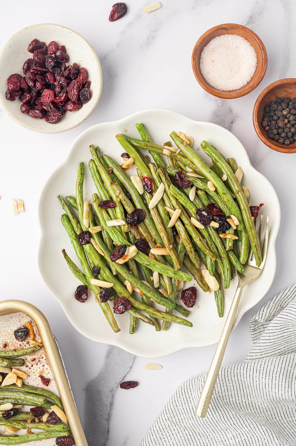 Baked green beans with honey balsamic glaze, cranberries and almonds.