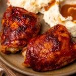 Juicy and tender oven roasted BBQ chicken thighs.