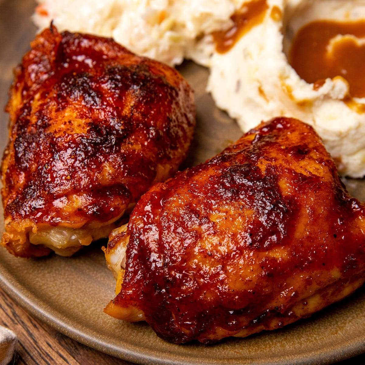 Juicy and tender oven roasted BBQ chicken thighs.