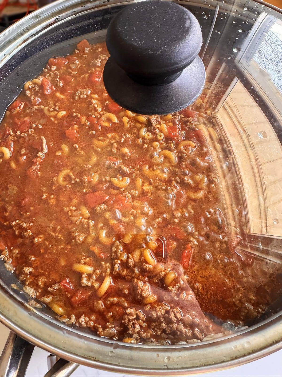 Cooking skillet taco pasta.