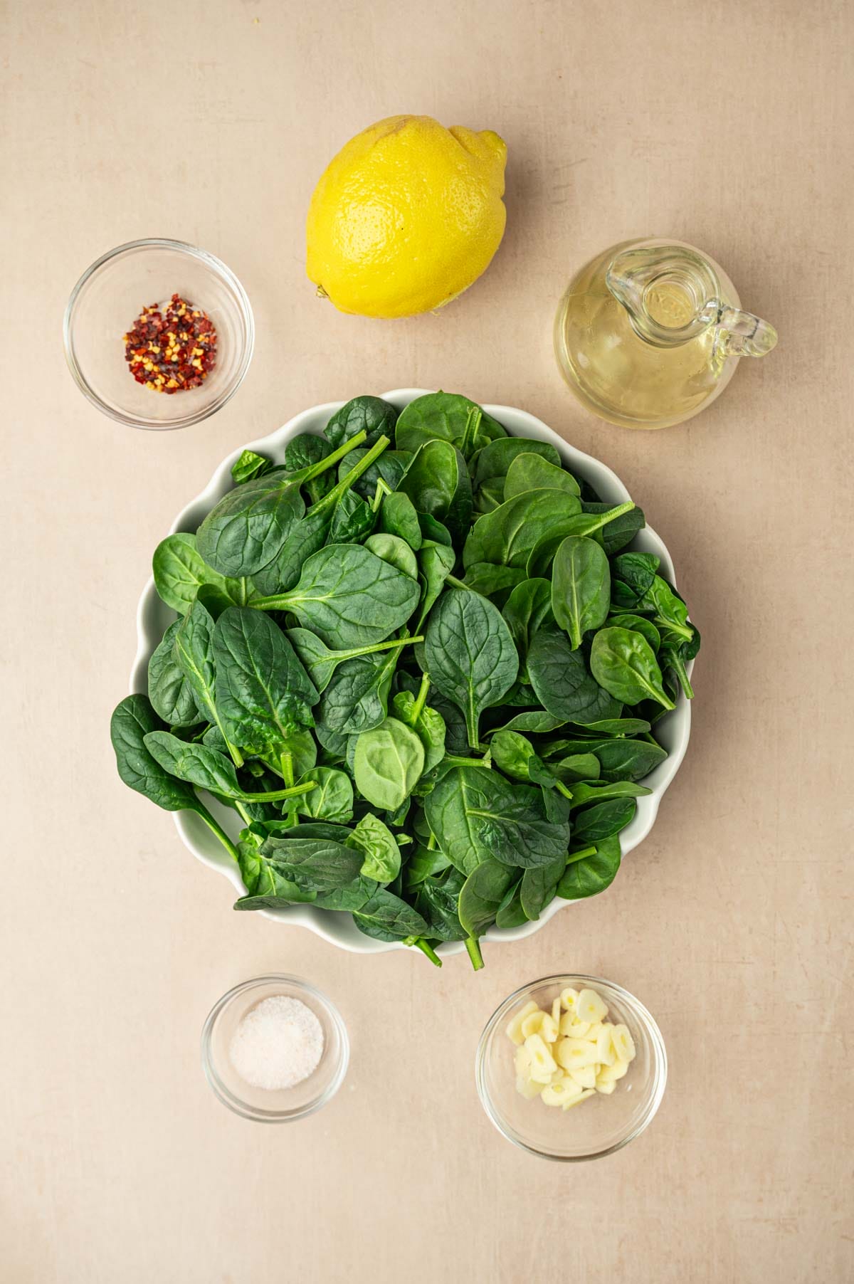 All the ingredients needed to make sautéed spinach.