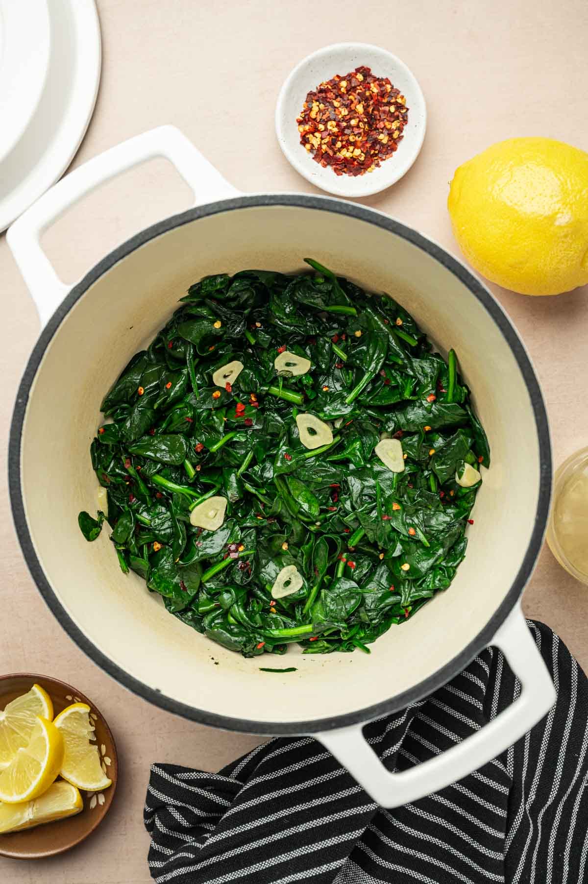 Sauteed spinach in a Dutch oven ready to eat.