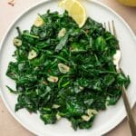 Easy stovetop sauteed spinach with slice of lemon