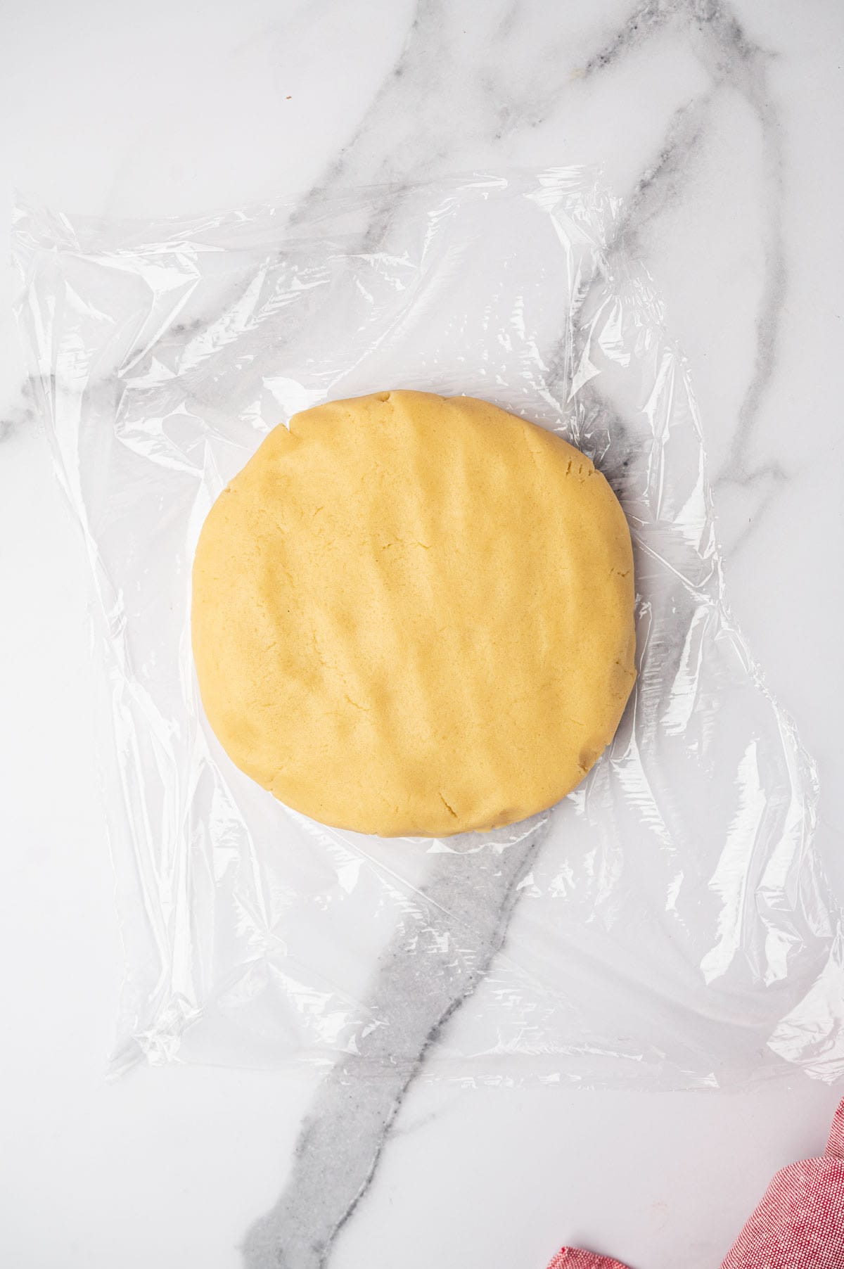 A ball of cookie dough for heart-shaped sugar cookies recipe.