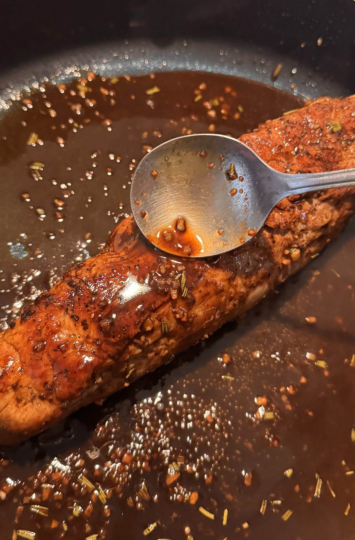 Cooking a pork tenderloin with a balsamic glaze.