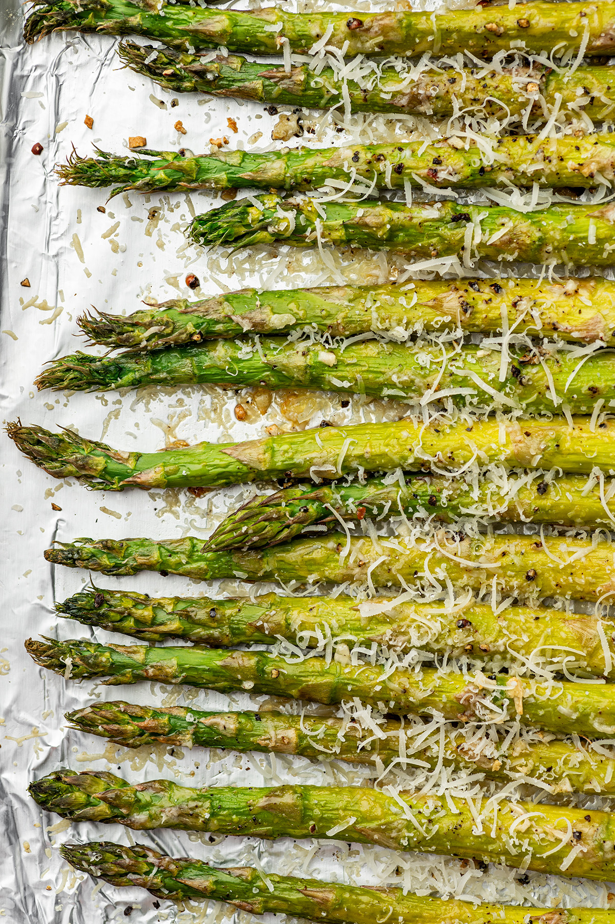 Garlic parmesan roasted asparagus on foil.