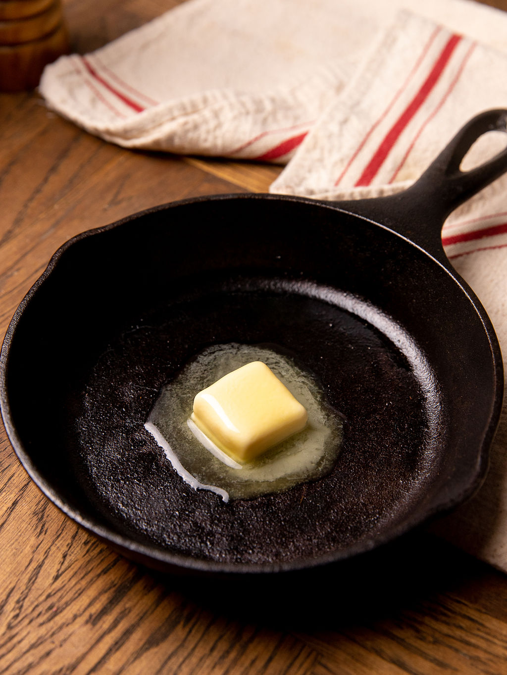 Melting butter in a cast iron skillet.
