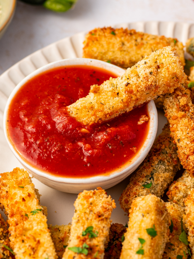 Air fryer zucchini fries with a side of marinara sauce.