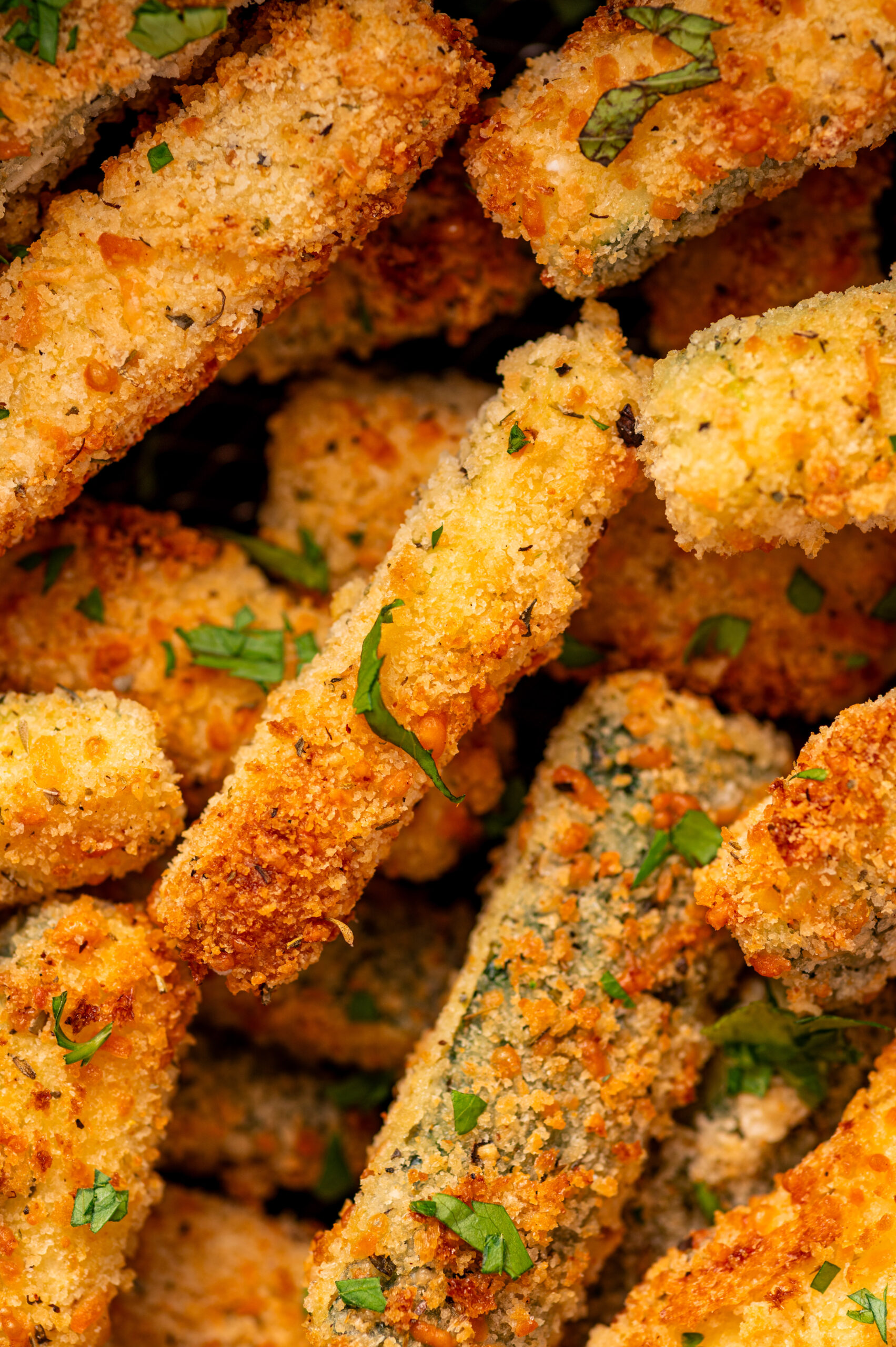 Close-up of crispy air fryer zucchini fries.